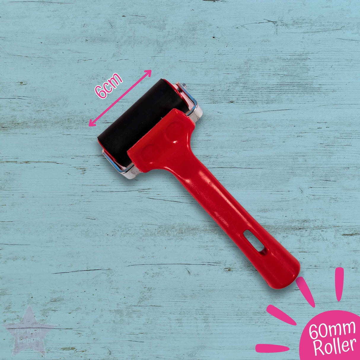 Red roller with black pad on a blue wooden surface, labeled '60mm Roller'.