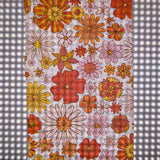 Floral patterned print on wet strength using a laser printer displayed over a studio light.