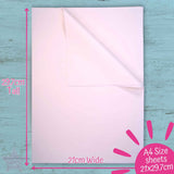 A4 size sheet of Wet Strength paper with dimensions labeled on a blue wooden surface